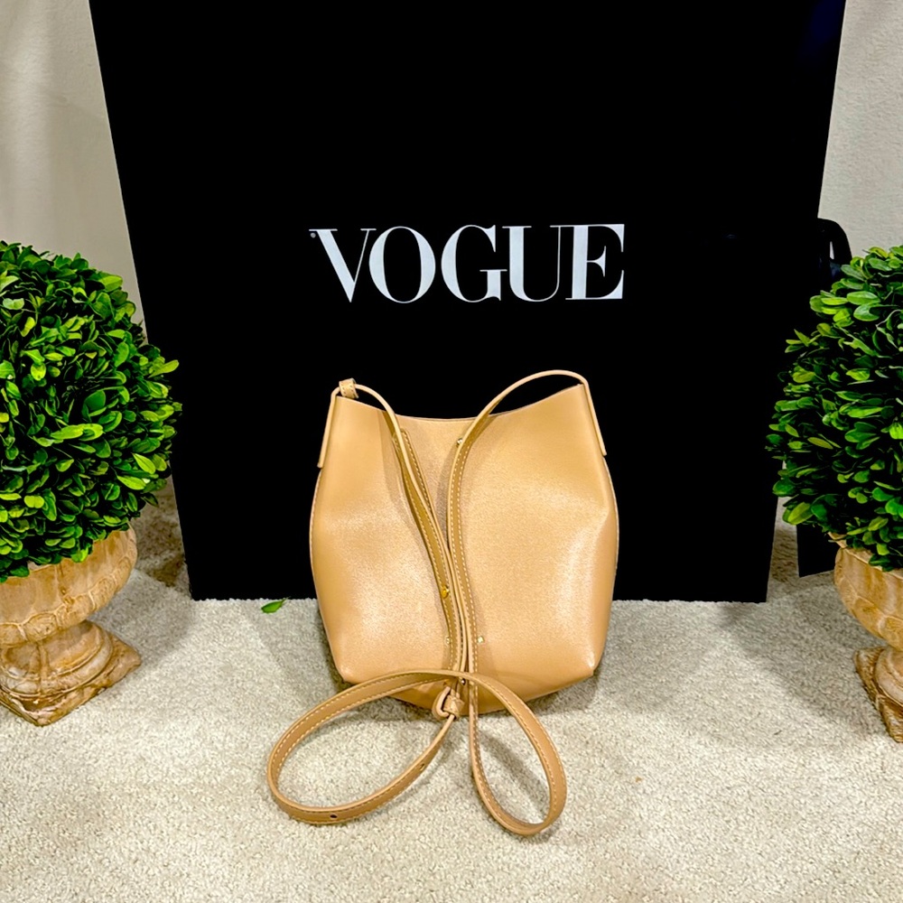 Small neutral beige/ light tan crossbody bag with gold tone trim